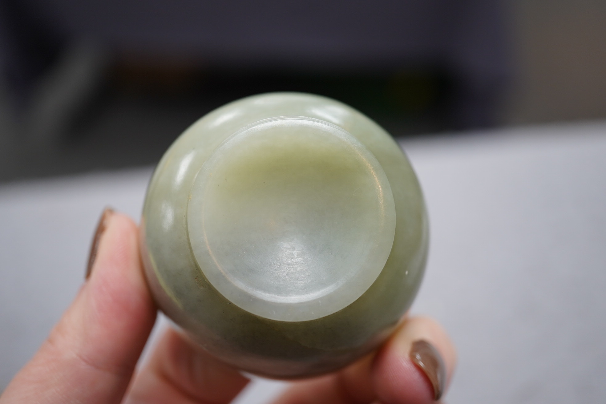 A Chinese pale celadon jade cup, 18th / 19th century